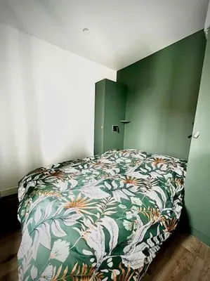 Un ou plusieurs lits dans un hébergement de l'établissement Le Jungle 2ème Étage