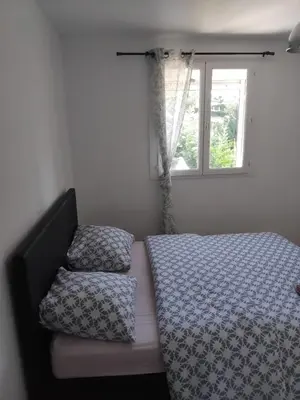 Un ou plusieurs lits dans un hébergement de l'établissement Joli appartement 2 pièces sur Liancourt
