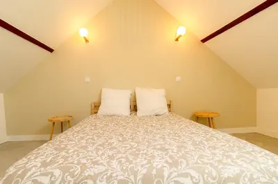Un ou plusieurs lits dans un hébergement de l'établissement Maison avec spa proche Giverny