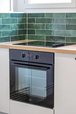Cuisine ou kitchenette dans l'établissement La Suite des 3 Tours spacieux 3 chambres