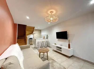 Télévision ou salle de divertissement dans l'établissement Appart cosy au cœur du Vexin