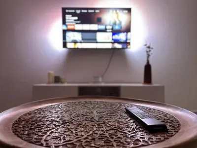 Télévision ou salle de divertissement dans l'établissement Appart cosy au cœur du Vexin