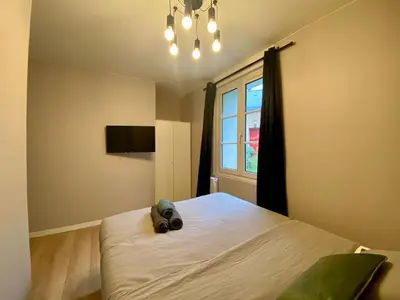 Un ou plusieurs lits dans un hébergement de l'établissement Appartement rempli de douceur - 350