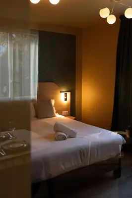 Un ou plusieurs lits dans un hébergement de l'établissement Villa Aura