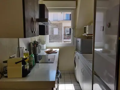 Cuisine ou kitchenette dans l'établissement Appart'HomeCity - Rouen Lessard