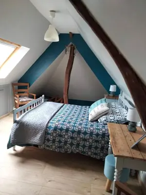 Un ou plusieurs lits dans un hébergement de l'établissement Maison accueillante à Petit-Caux avec jardin
