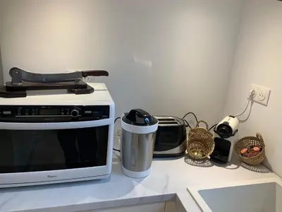 Cuisine ou kitchenette dans l'établissement L Entre deux choses