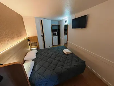 Un ou plusieurs lits dans un hébergement de l'établissement HOTEL PREMIERE CLASSE Rouen Sud Oissel