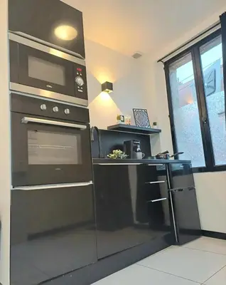 Cuisine ou kitchenette dans l'établissement Le Quantum Room - Avec Netflix et Amazon Prime