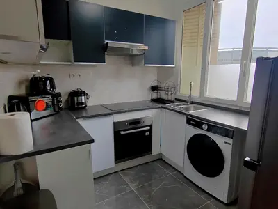 Cuisine ou kitchenette dans l'établissement Appartement en centre ville - 5 min de la Gare - 62 m2 - 1 à 6 pers