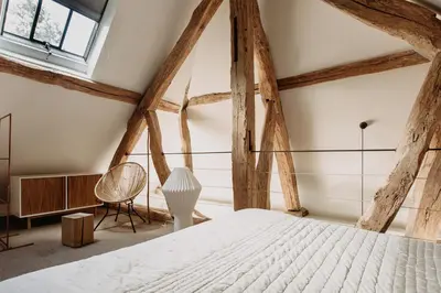 Un ou plusieurs lits dans un hébergement de l'établissement La Dime de Giverny - Cottages-Spa-restaurant