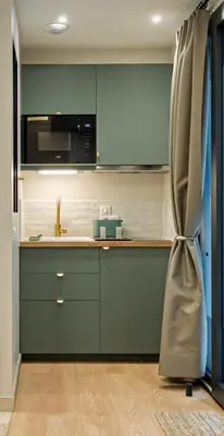 Cuisine ou kitchenette dans l'établissement La Love-Room d'Alice balnéo et vidéo-projecteur !