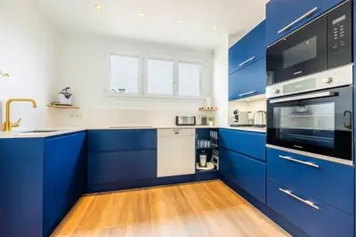 Cuisine ou kitchenette dans l'établissement Le Cocon de l'Oise - F2 Cosy au bord de l'eau