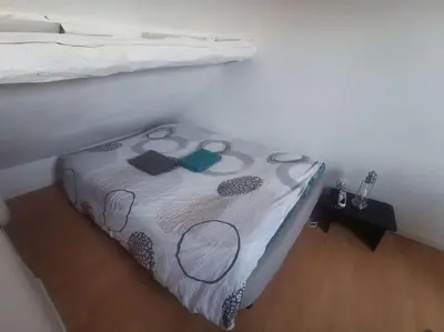 Un ou plusieurs lits dans un hébergement de l'établissement Duplex House Paris-CDG-Astérix