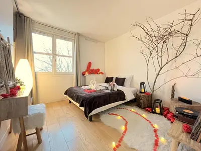 Un ou plusieurs lits dans un hébergement de l'établissement L'Escapade Romantique