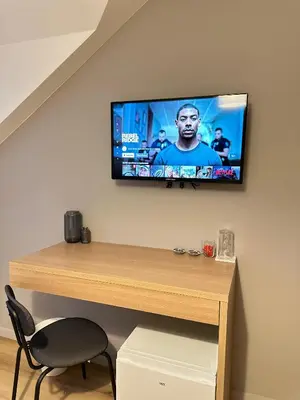 Télévision ou salle de divertissement dans l'établissement Chambre privée 