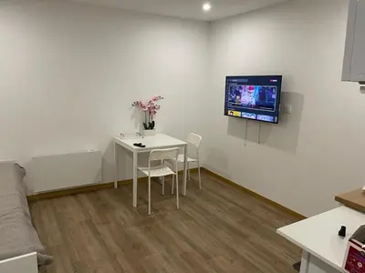 Télévision ou salle de divertissement dans l'établissement Petite maison