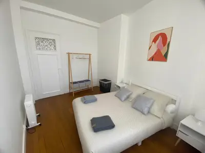 Un ou plusieurs lits dans un hébergement de l'établissement Coeur de ville - Appartement 2 chambres