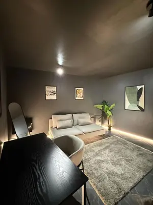 Coin salon dans l'établissement Cosy Room & SAUNA Hypercentre Dieppe