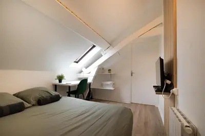 Un ou plusieurs lits dans un hébergement de l'établissement Le Nid - Studio in Hypercentre - Cathédrale