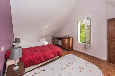 Un ou plusieurs lits dans un hébergement de l'établissement Grand Gîte des Hautes Maisons