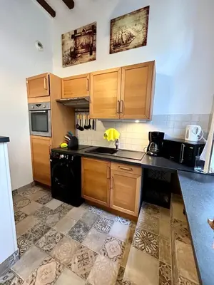 Cuisine ou kitchenette dans l'établissement L'escapade en mezzanine