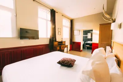 Télévision ou salle de divertissement dans l'établissement The Gem