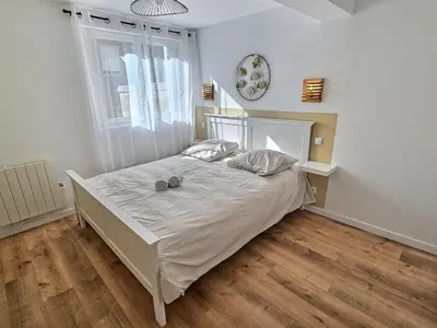 Un ou plusieurs lits dans un hébergement de l'établissement Maisonette Cozy, Neuf, Centre-ville, Wifi
