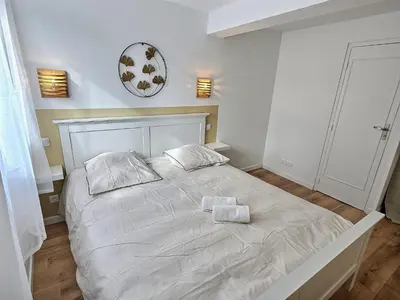 Un ou plusieurs lits dans un hébergement de l'établissement Maisonette Cozy, Neuf, Centre-ville, Wifi