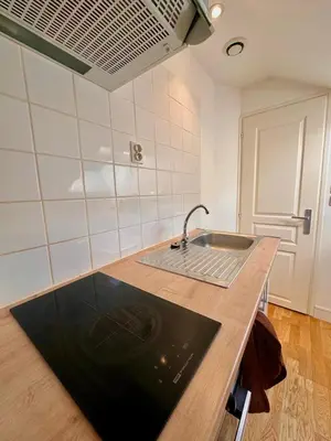 Cuisine ou kitchenette dans l'établissement Appartement Cosy avec Netflix et parking gratuit