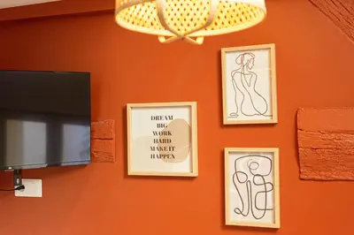 Télévision ou salle de divertissement dans l'établissement Terracotta