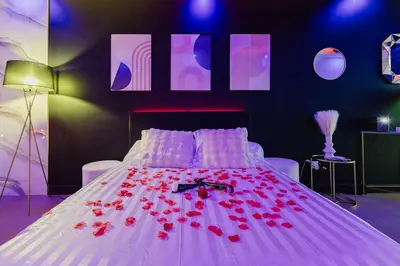 Un ou plusieurs lits dans un hébergement de l'établissement La cachette romantique