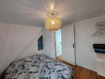 Un ou plusieurs lits dans un hébergement de l'établissement Charmant Duplex au coeur de Dieppe