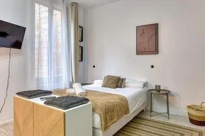 Un ou plusieurs lits dans un hébergement de l'établissement L'Écrin Normand un studio au cœur de Rouen