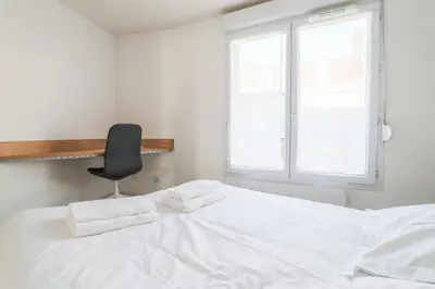 Un ou plusieurs lits dans un hébergement de l'établissement Cosy en centre ville