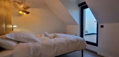 Un ou plusieurs lits dans un hébergement de l'établissement La Villa Oswar Wilde