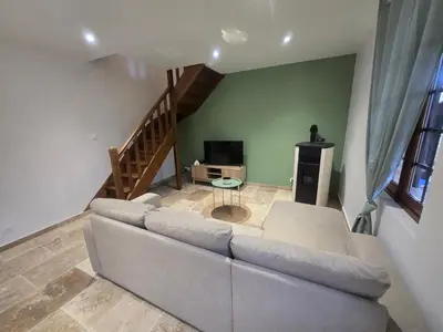Télévision ou salle de divertissement dans l'établissement Maison Normande bord de rivière