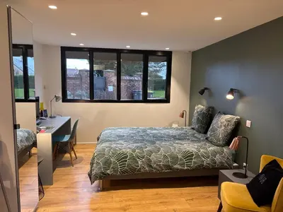 Un ou plusieurs lits dans un hébergement de l'établissement Appartement contemporain
