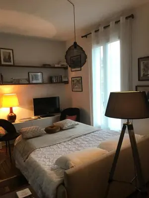Un ou plusieurs lits dans un hébergement de l'établissement Appartement ancien cosy