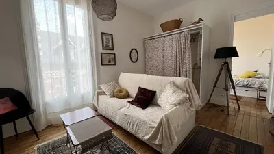 Coin salon dans l'établissement Appartement ancien cosy