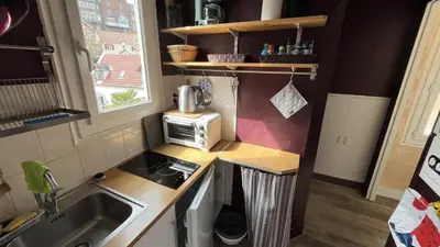 Cuisine ou kitchenette dans l'établissement Appartement ancien cosy