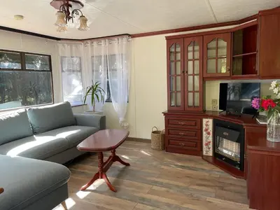 Télévision ou salle de divertissement dans l'établissement Le Gîte des Oiseaux Un Mobil-Home au Cœur des Champs