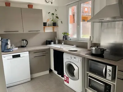 Cuisine ou kitchenette dans l'établissement Escale à Beauvais