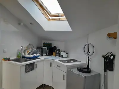Cuisine ou kitchenette dans l'établissement Chambre Privée