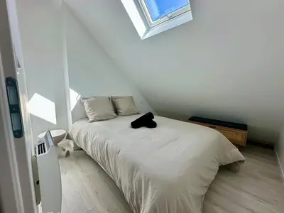 Un ou plusieurs lits dans un hébergement de l'établissement Le Duplex Appartement