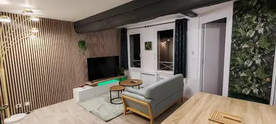 Télévision ou salle de divertissement dans l'établissement L'Oasis Amiénoise - Le Quai Amiénois