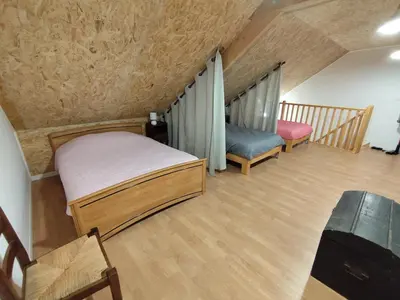 Un ou plusieurs lits dans un hébergement de l'établissement Gîte Les Marettes