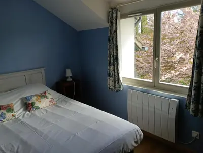 Un ou plusieurs lits dans un hébergement de l'établissement Cottage Les Quatre Saisons