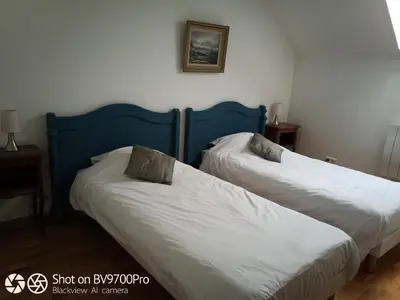 Un ou plusieurs lits dans un hébergement de l'établissement Cottage Les Quatre Saisons