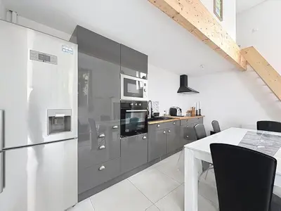 Cuisine ou kitchenette dans l'établissement Loft cosy jaccuzi & terrasse